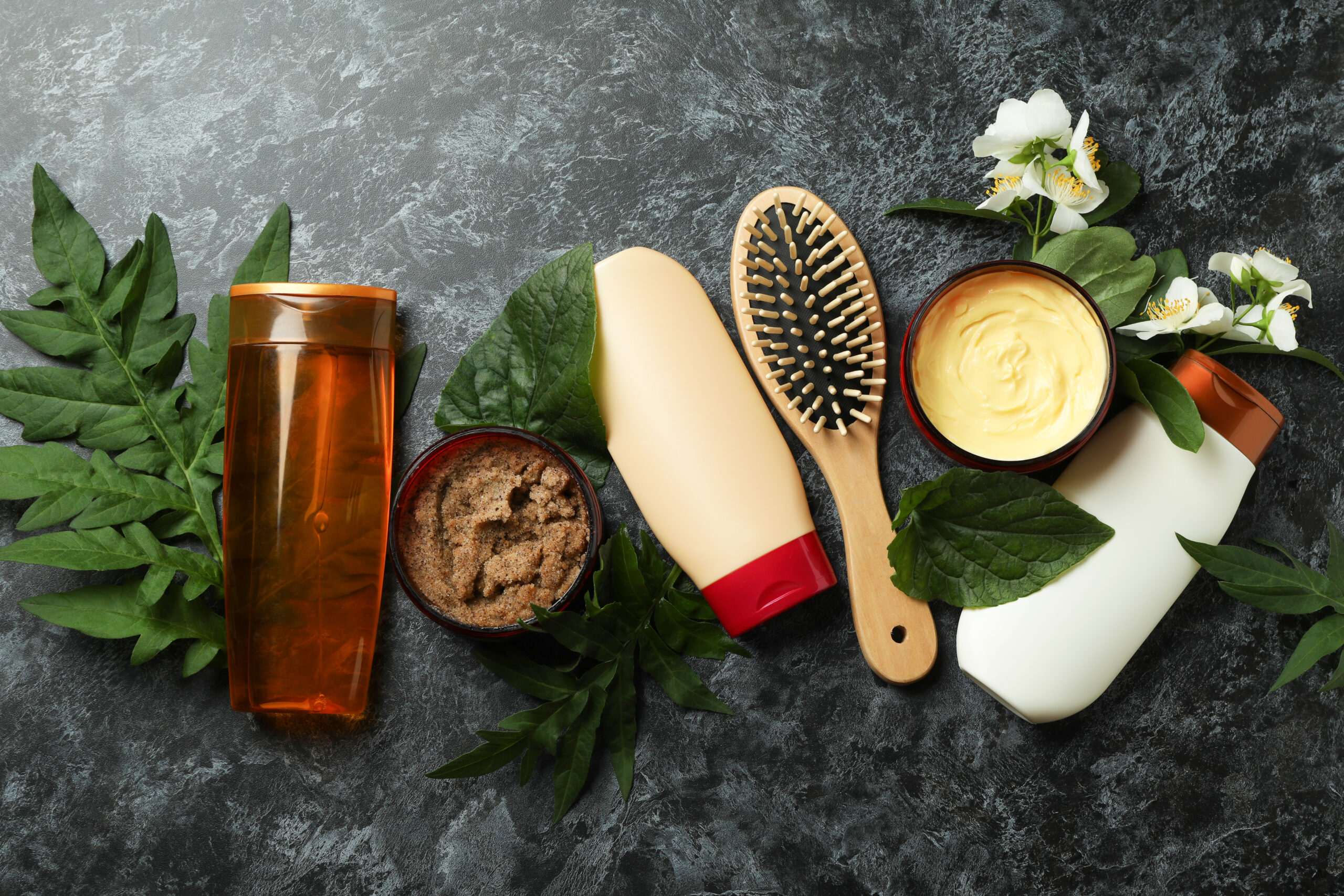 Hair care accessories on black smokey background